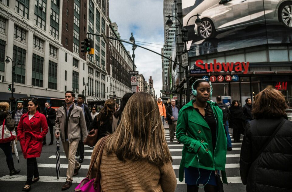 People walking across a zebra crossing