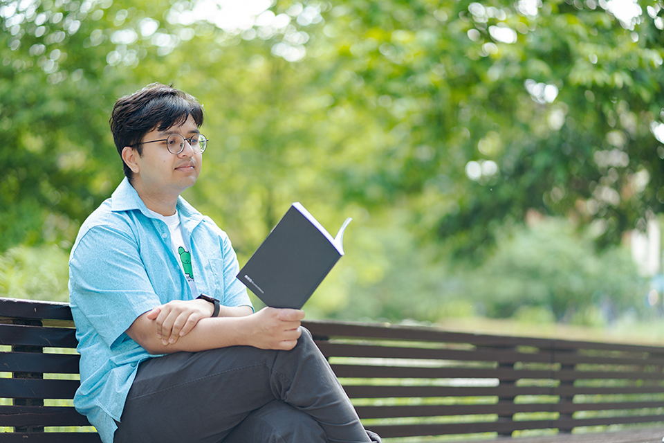 student reading in the park