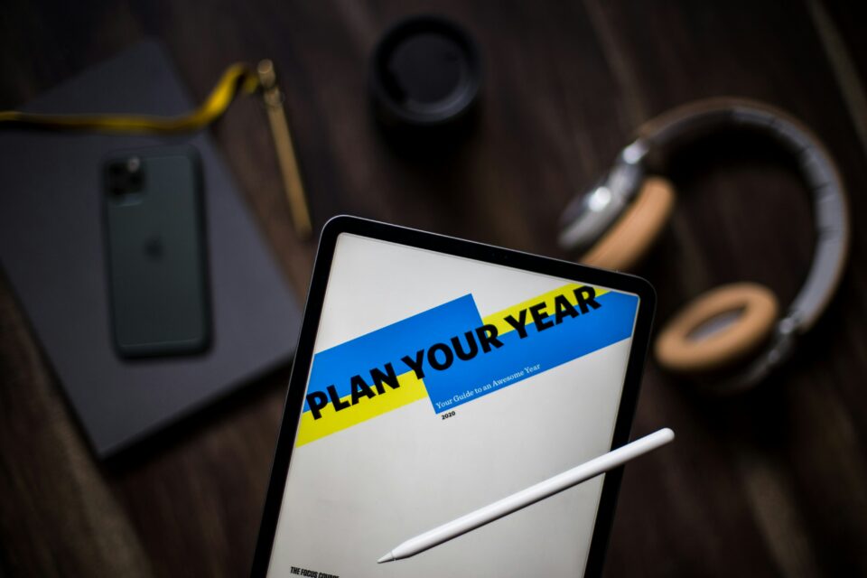 A tablet with the words plan your year on it