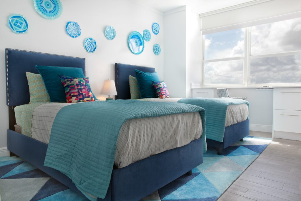 blue twin beds next to each other 