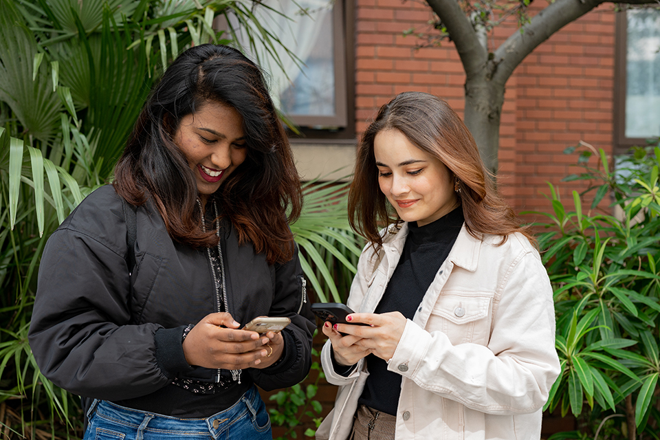 international students on their phone in London