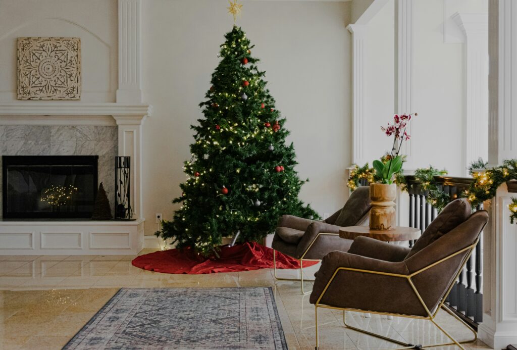 A scenic picture of a Christmas tree in the living room 