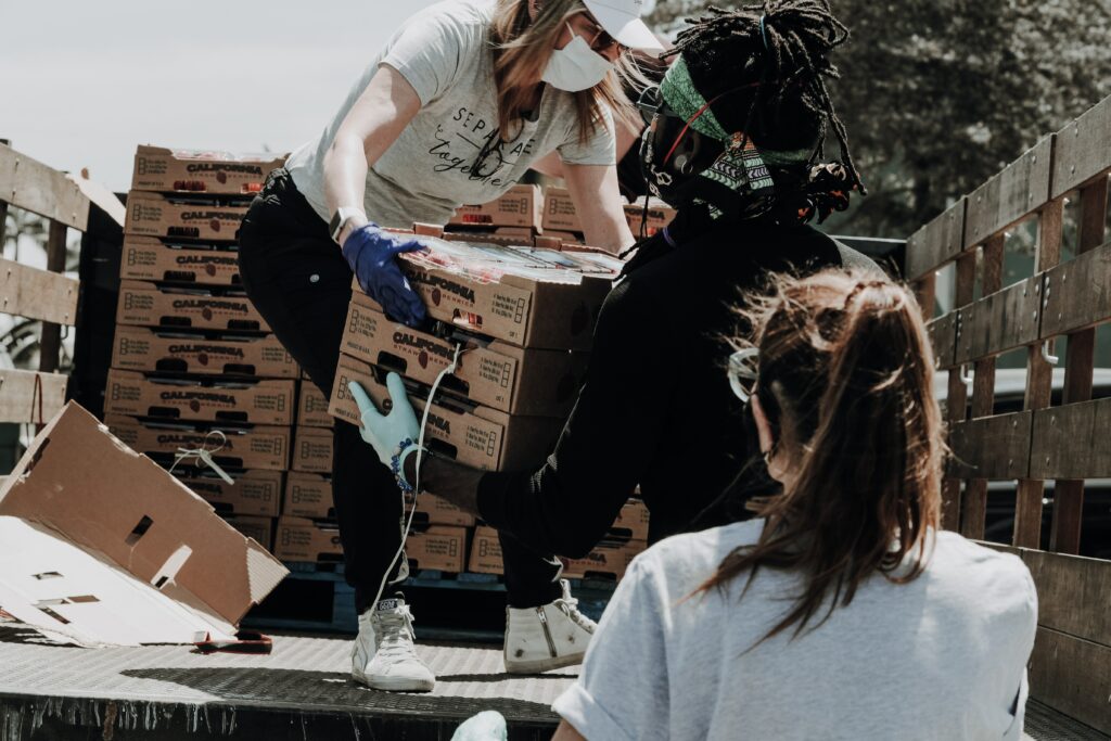 Two People passing boxes to each other 