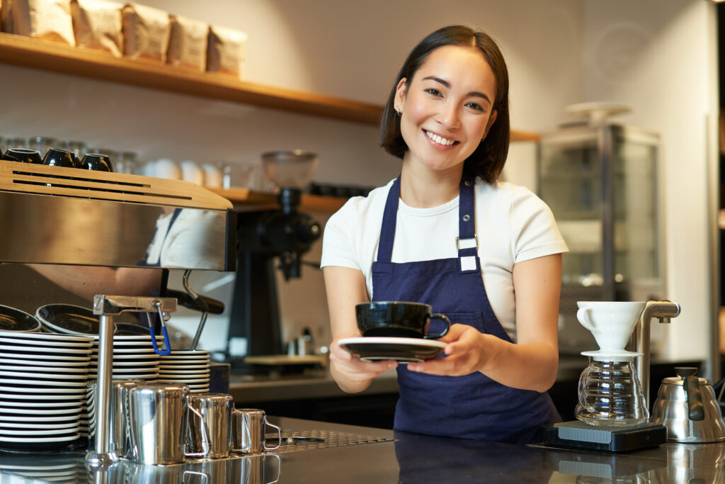 Student working part-time in cafe.