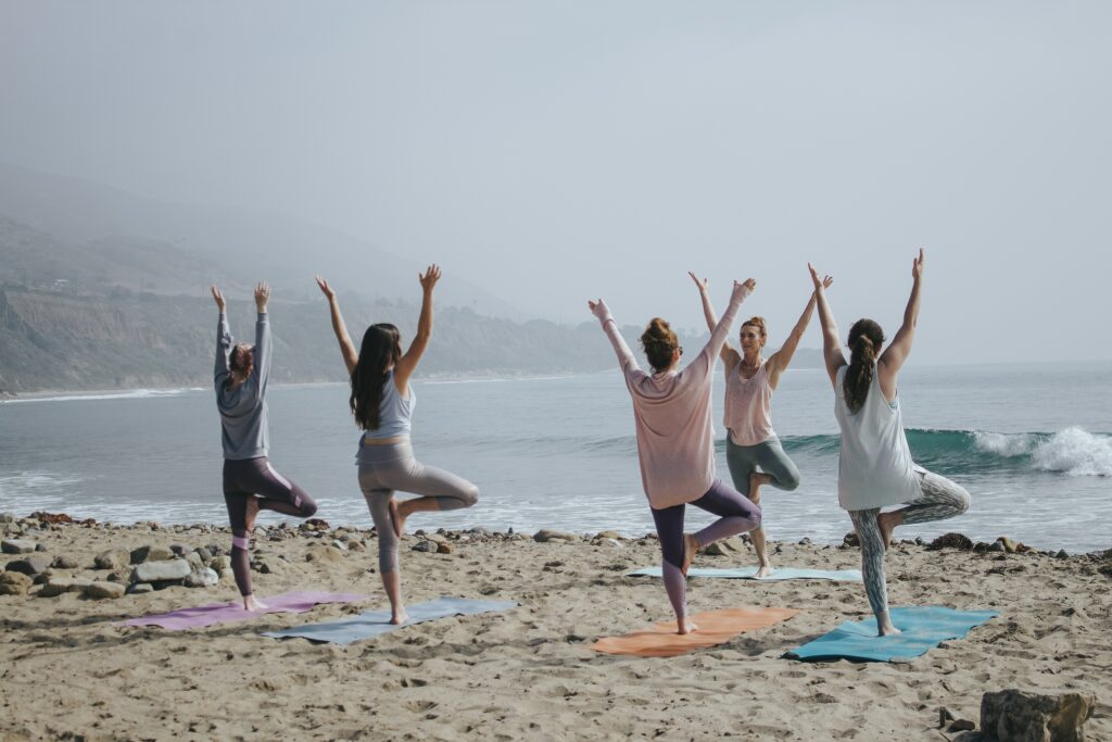 A group of people doing yoga 