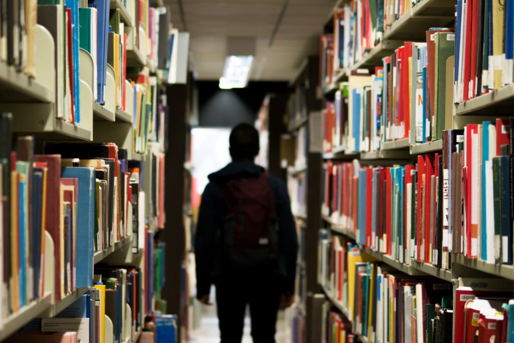 A student in the library by themselves 