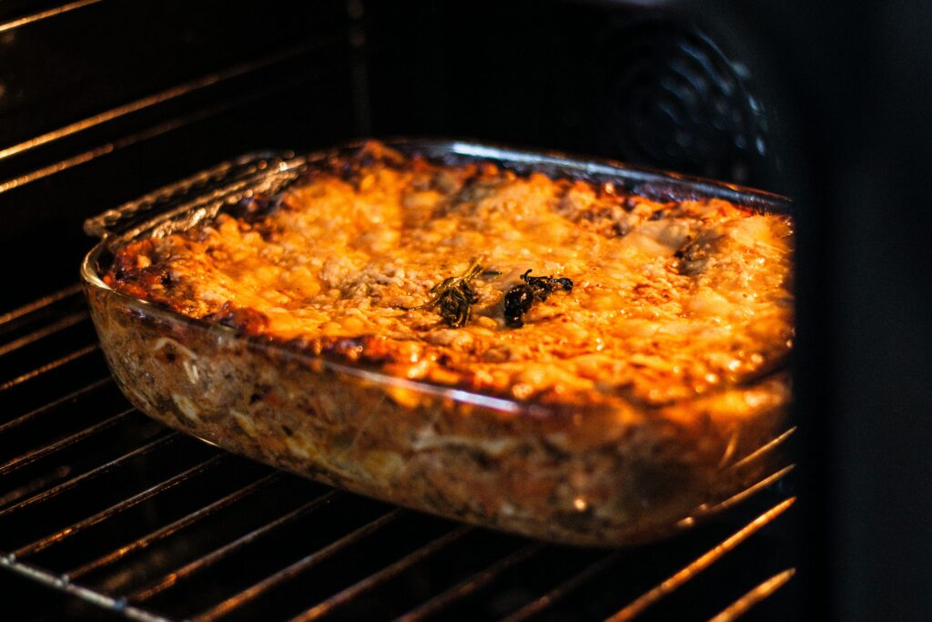 A lasagne cooking in the oven 