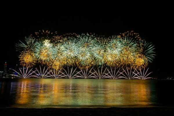 A bunch of fireworks shooting in the sky