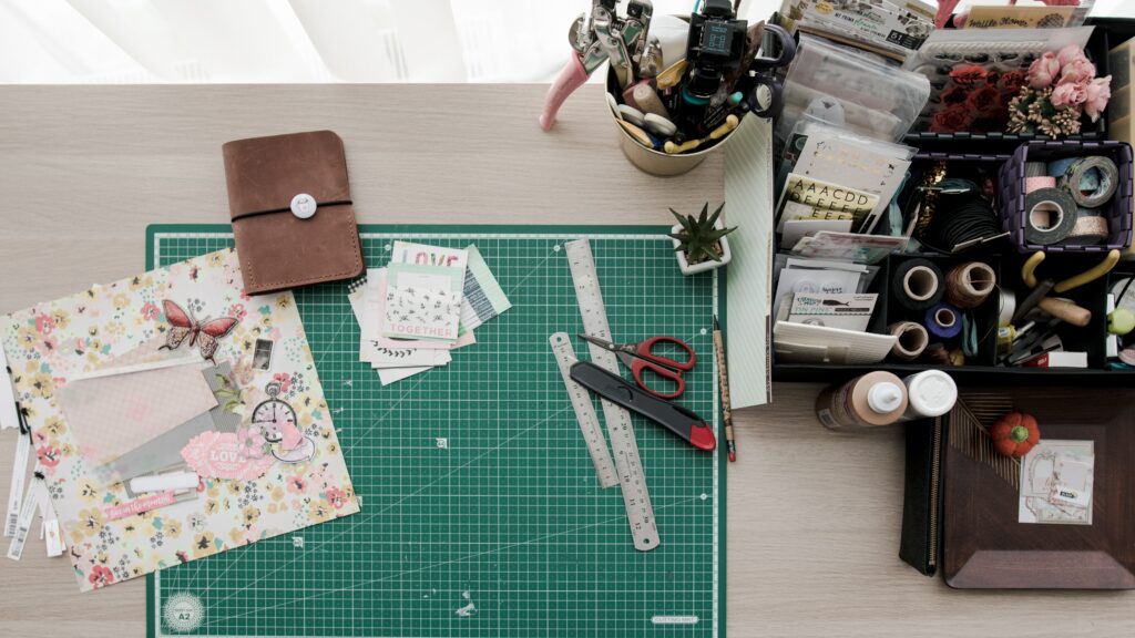 A Birdseye view of a table with crafts to make something with 