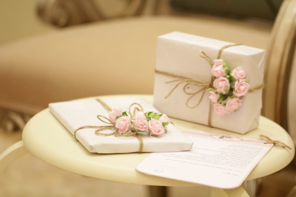 Plain wrapping paper with a brown string on it with pink flowers