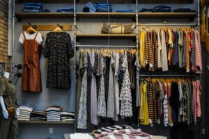 A bunch of clothes on a clothing rack