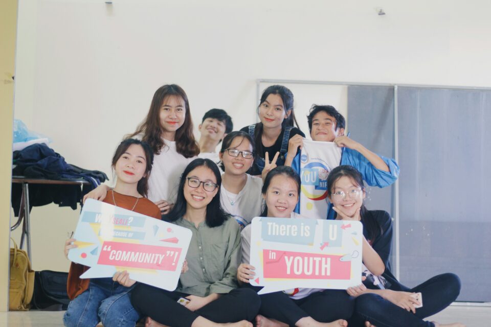 A group of students holding up signs