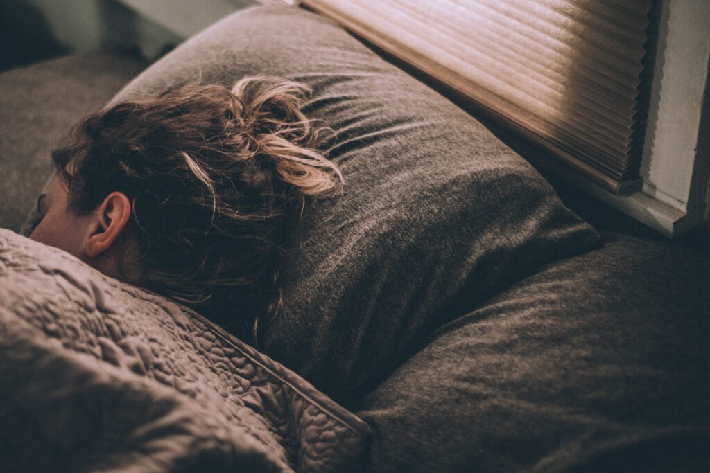 A woman sleeping peacefully in her bed 