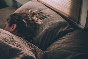 A woman sleeping peacefully in her bed