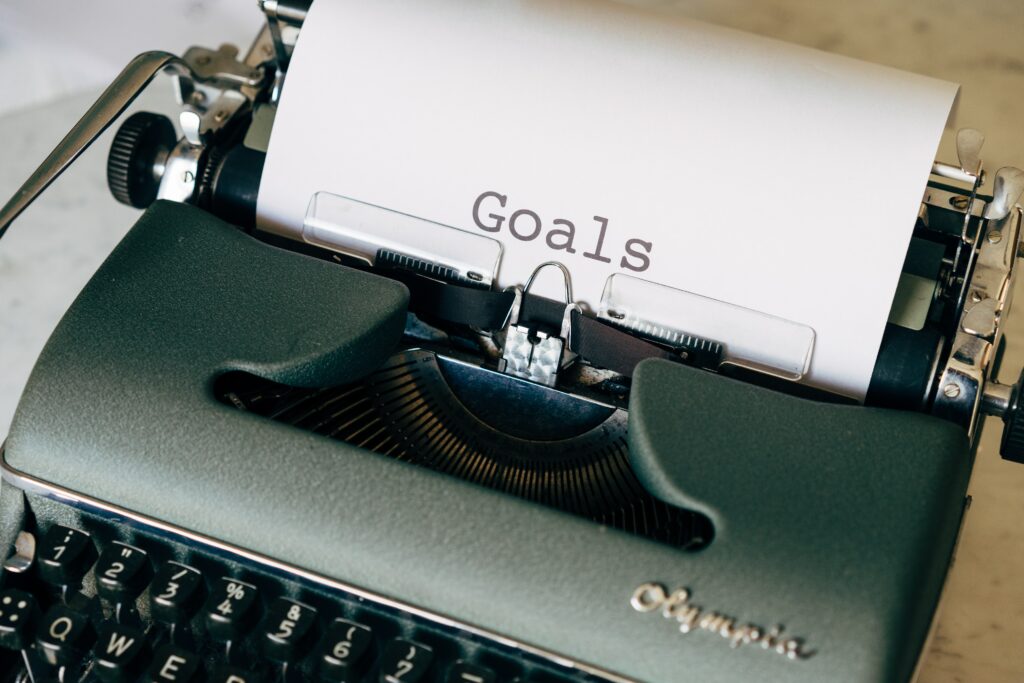 A typewriting with the words Goal in bold 