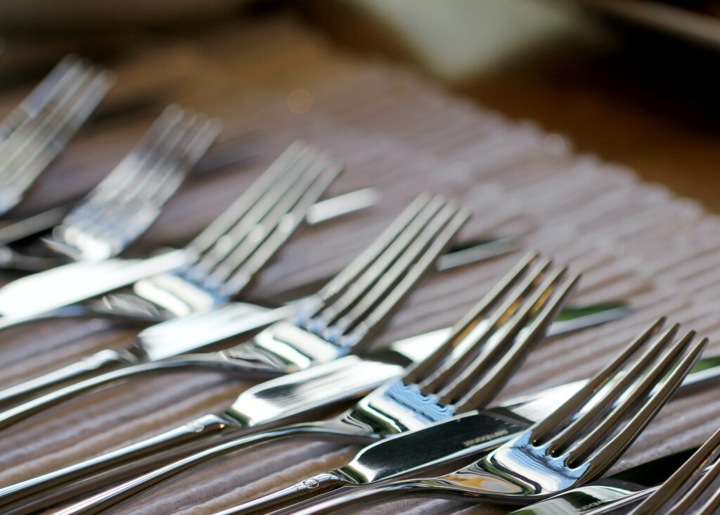a row of forks and knives 