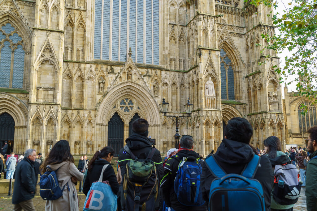 A group of people looking at a building 