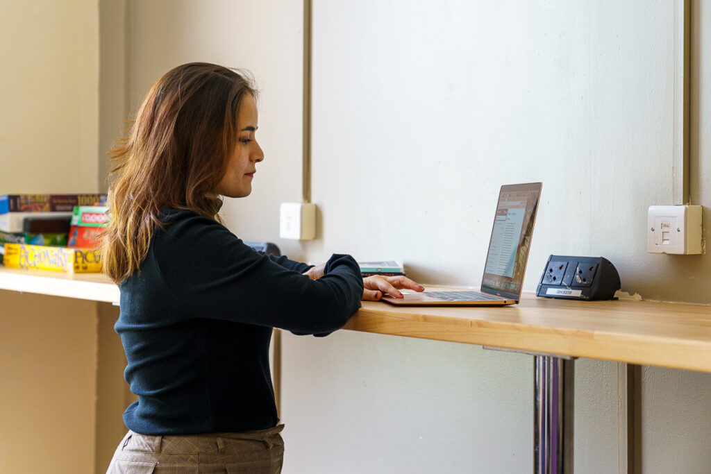 A girl with her laptop open 