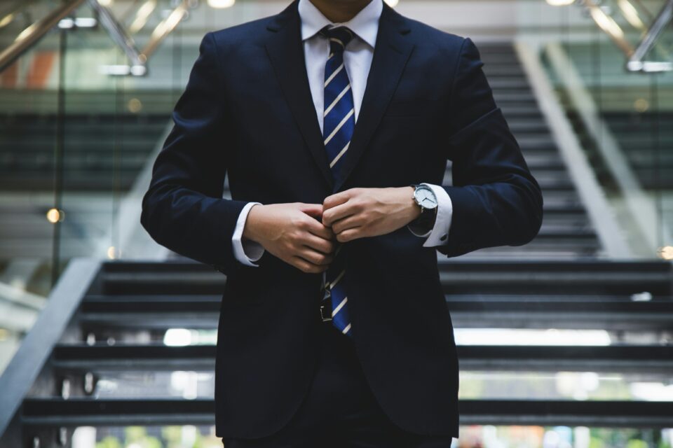 A man closing his suit