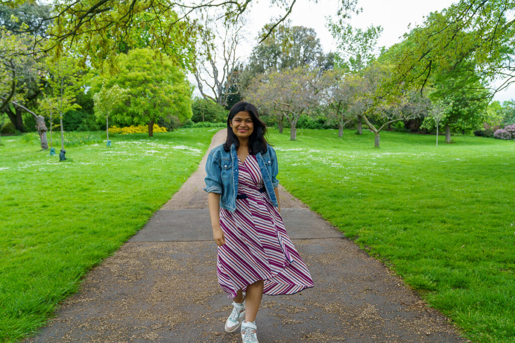 A girl smiling at the park 