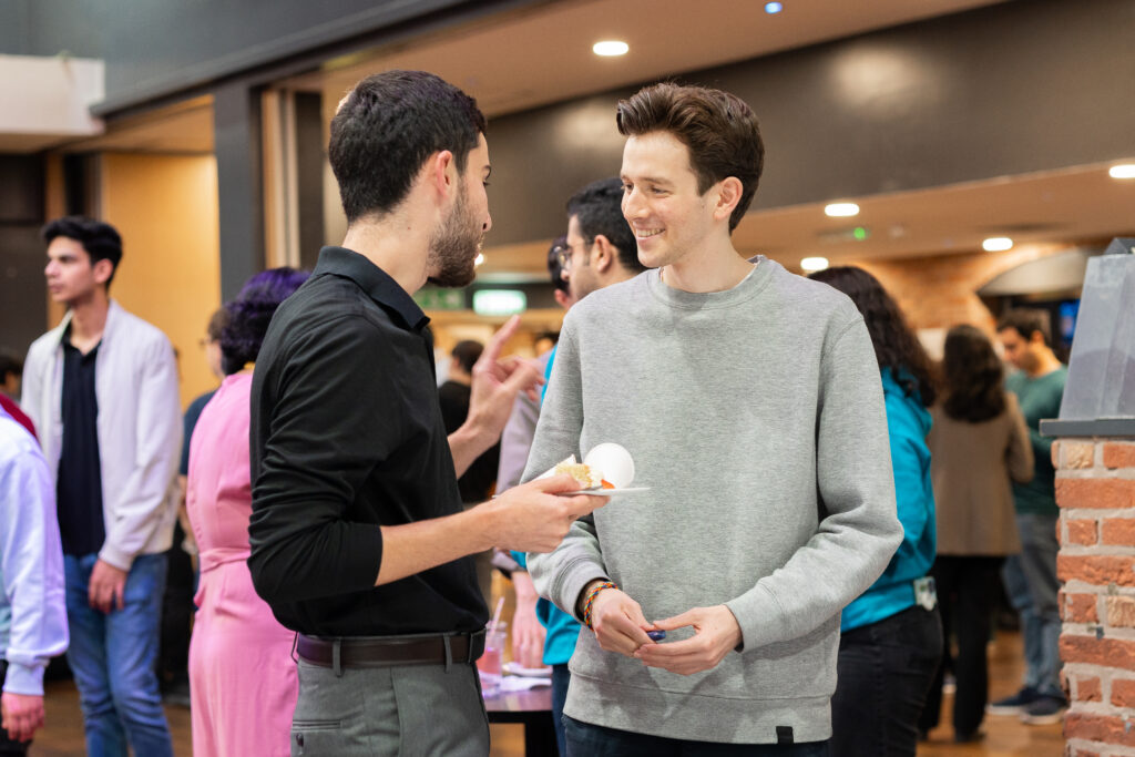 Two guys talking to each other 