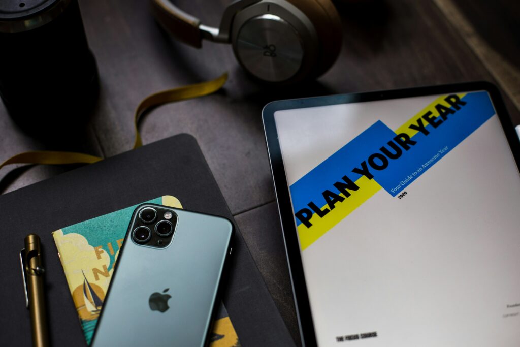 A tablet with the words plan your year on it with a I phone next to it 