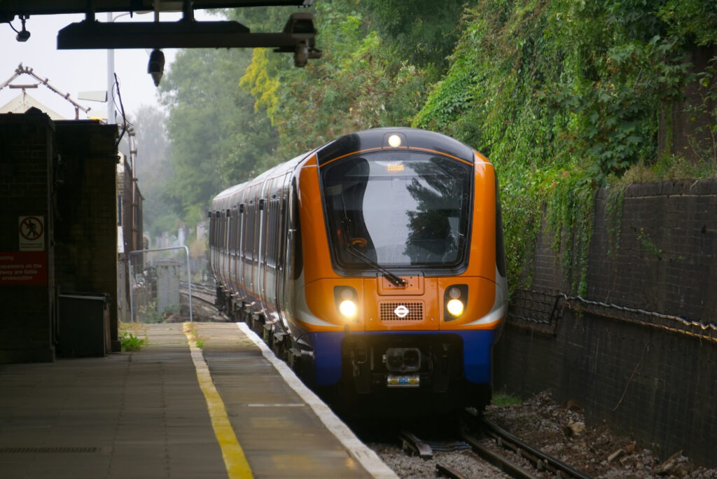 The Overground tube coming into a station