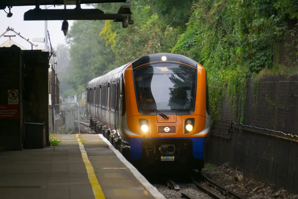 The Overground tube coming into a station