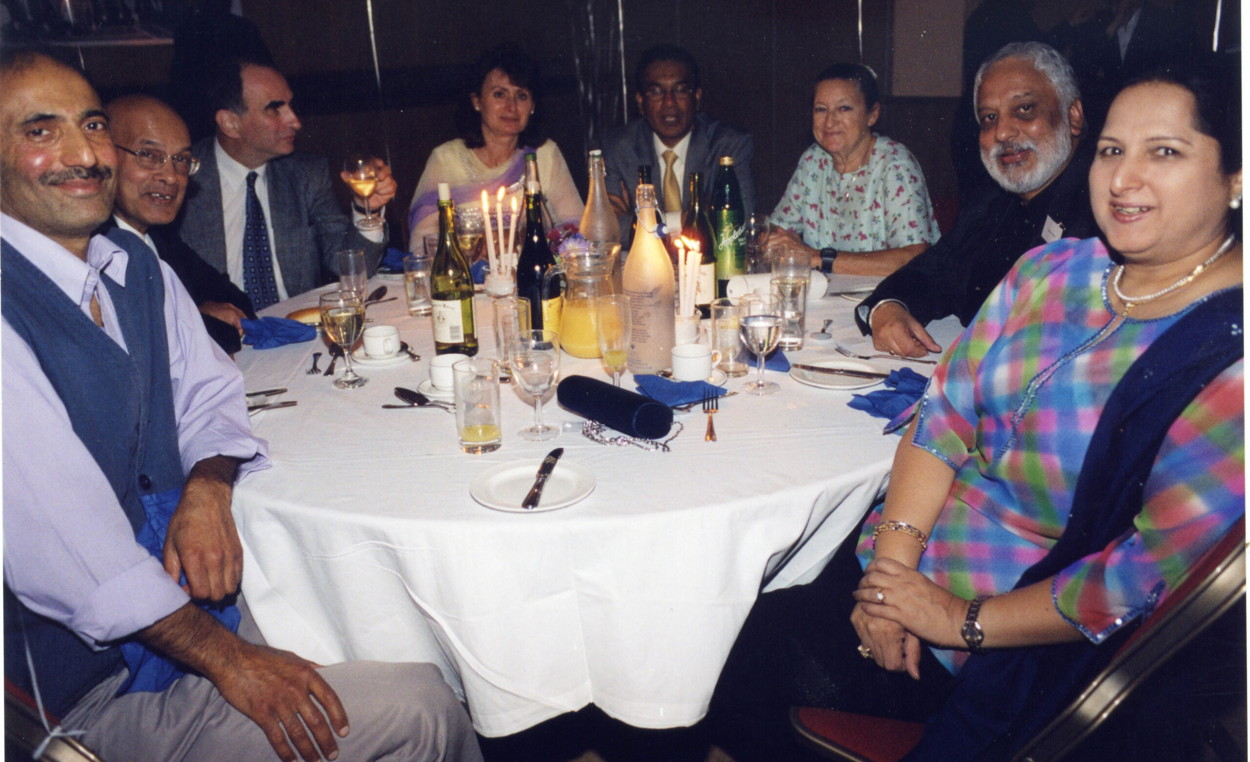 Jean Basell at London Reunion third from the right a group of people seated around a table at an event